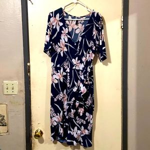 Blue crossover dress with flowers.